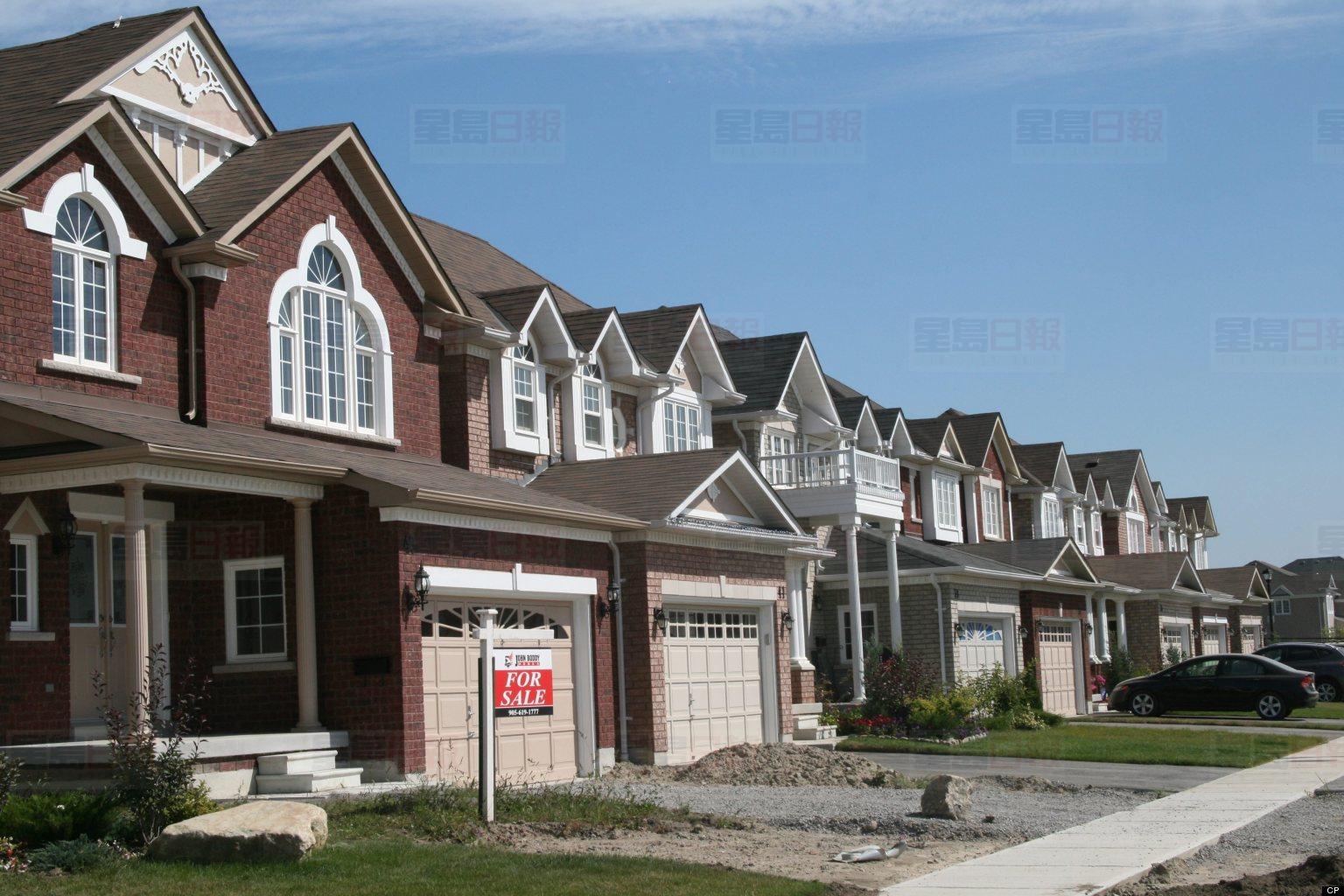 A house is advertised for sale in a new housing development in Ajax, Ont. a suburb east of Toronto. The Canadian Press Images/Steve White
