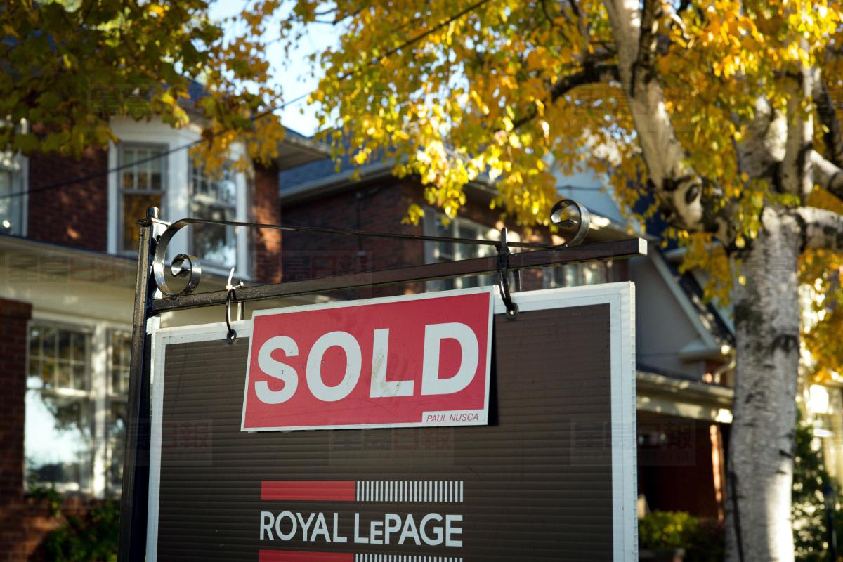 NOV.4, 2016 FILE PHOTO A real estate sold sign hangs in front of a west-end Toronto property Friday, Nov. 4, 2016. The number of homes sold throughout the country last month hit a record for October, the Canadian Real Estate Association said Tuesday. THE CANADIAN PRESS/Graeme Roy