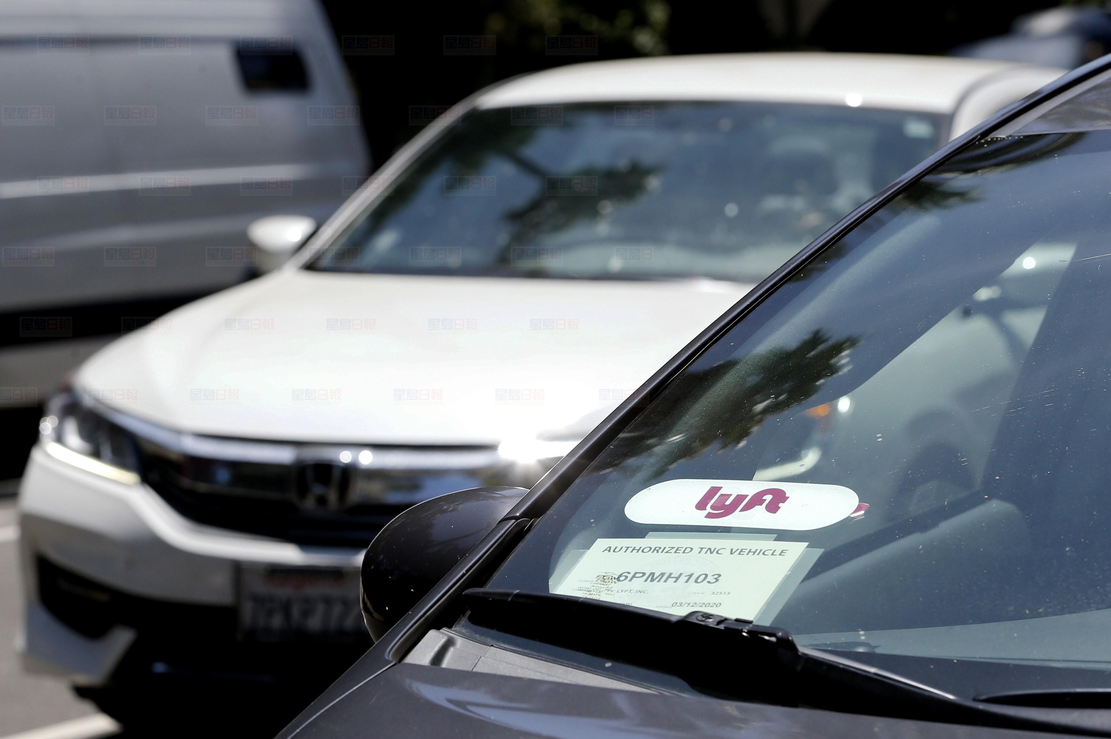 A Lyft ride-share car waits at a stoplight in Sacramento, Calif. on July 9, 2019. Ride-hailing company Lyft says it plans to be operating in Vancouver before the end of this year.The Passenger Transportation Board in B.C. has yet to unveil its final regulations for ride-hailing companies, but a statement from Lyft says the company is confident operations will begin in the Lower Mainland sometime this fall. THE CANADIAN PRESS/AP, Rich Pedroncelli