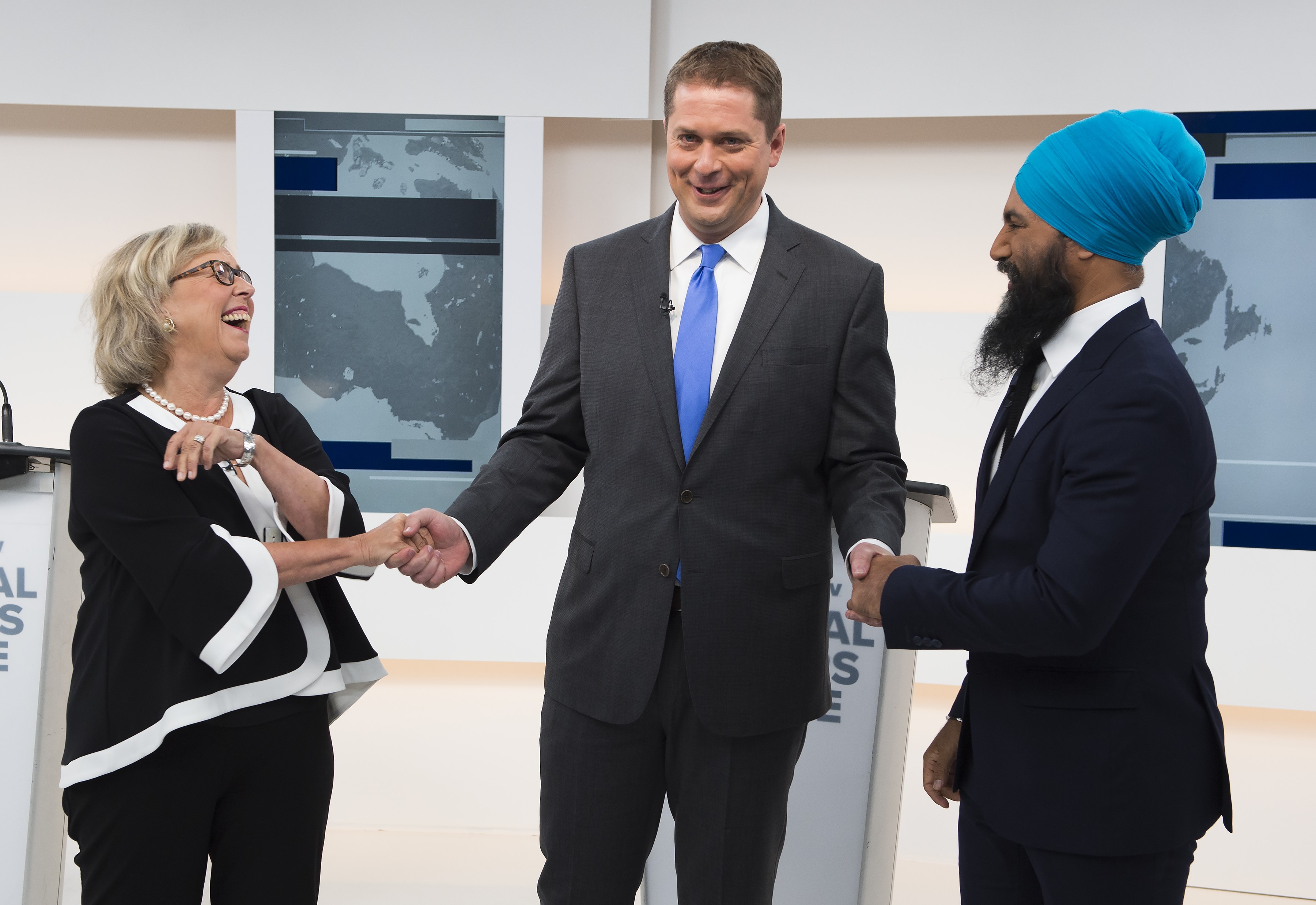 Green Party Leader Elizabeth May, left, Conservative Leader Andrew Scheer, centre, and NDP Leader Jagmeet Singh shake hands during the Maclean's/Citytv National Leaders Debate in Toronto on Thursday, Sept. 12, 2019. THE CANADIAN PRESS/Frank Gunn